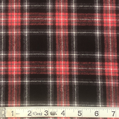 Cotton rodeo flannel in black, red & white shown with ruler to measure plaid